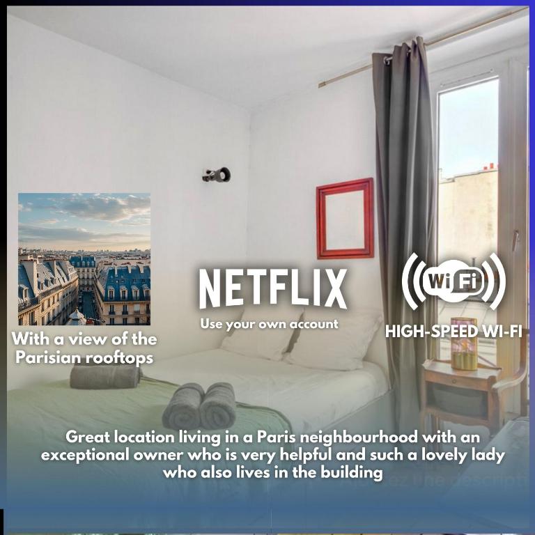 une publicité pour une chambre d'hôtel avec vue sur les toits des appartements dans l'établissement Charming Studio in North Paris Center, à Paris