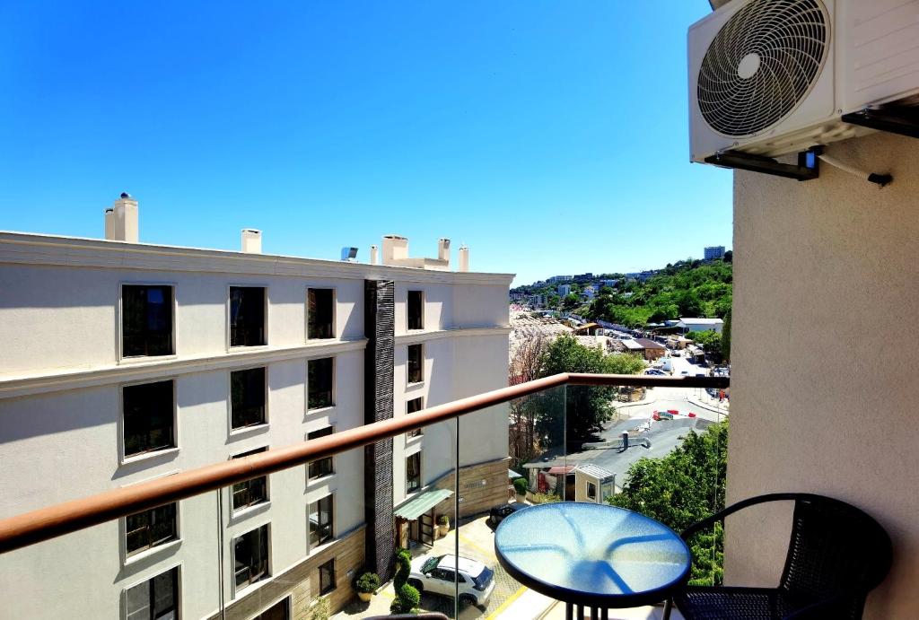 a balcony with a view of a building at Cabacum Pleasure Beachfront Apartments in Varna City