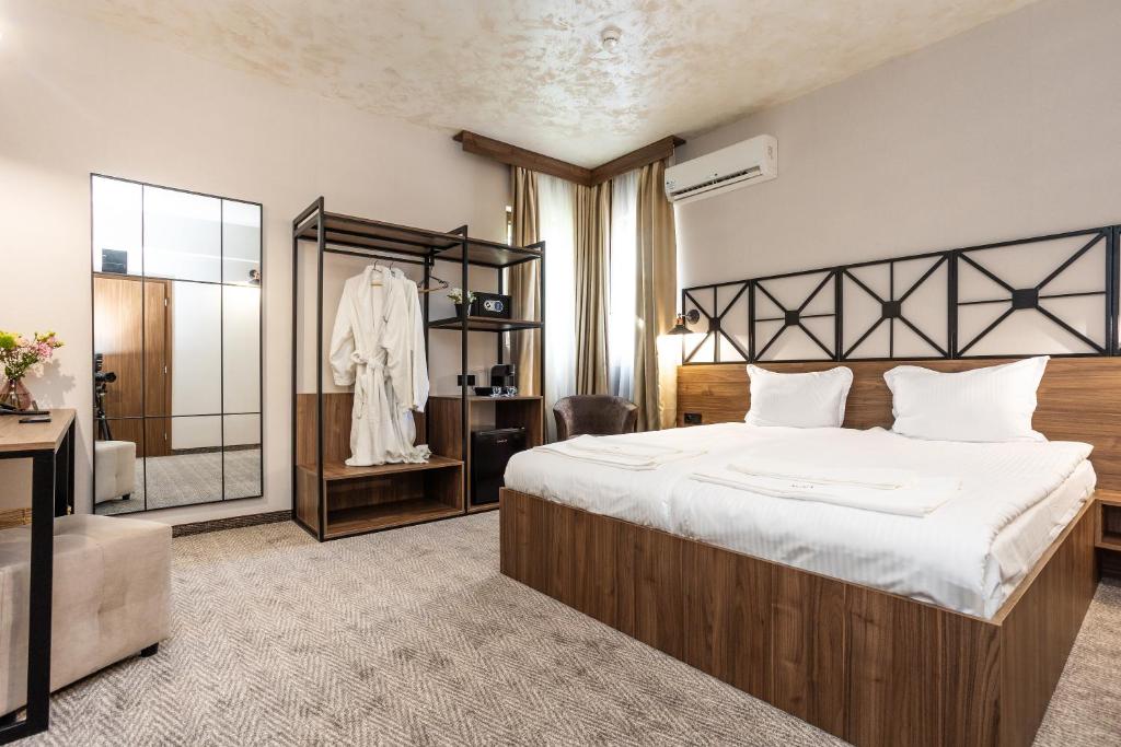 Ένα ή περισσότερα κρεβάτια σε δωμάτιο στο Noma Boutique Hotel - Adults only