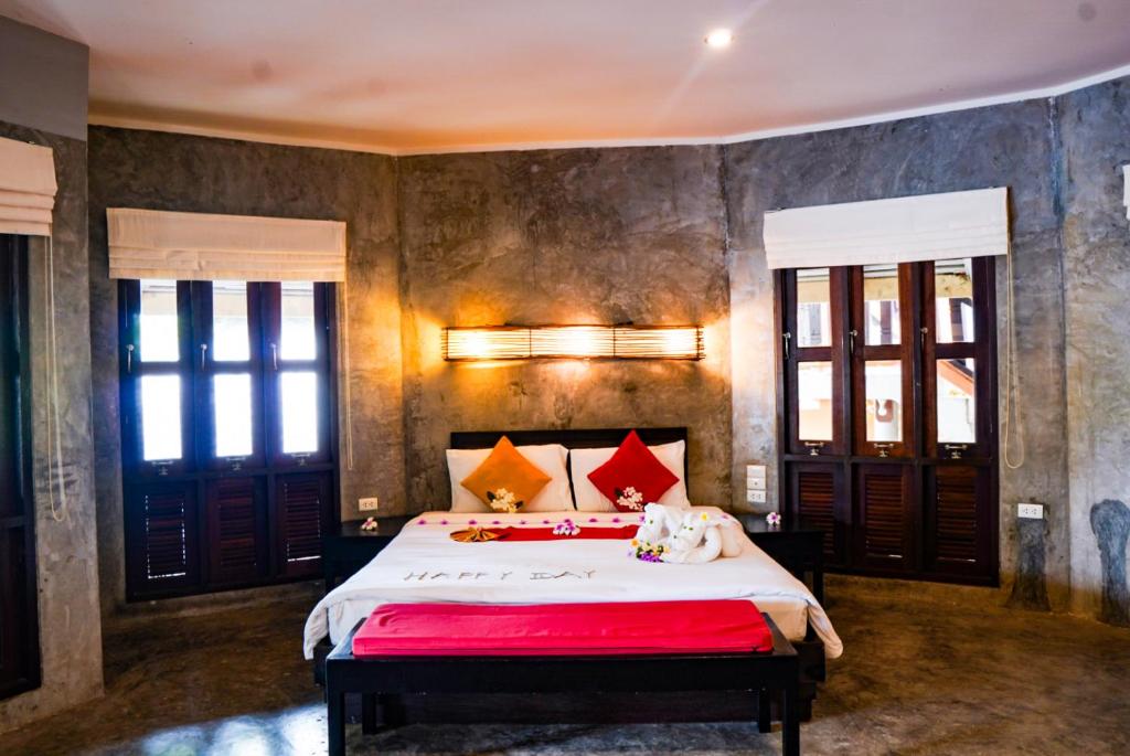 Postel nebo postele na pokoji v ubytování The Hideaway Pariya Haad Yuan Ko Pha-ngan