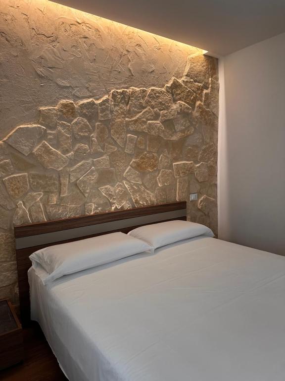 Ένα ή περισσότερα κρεβάτια σε δωμάτιο στο Leonardo