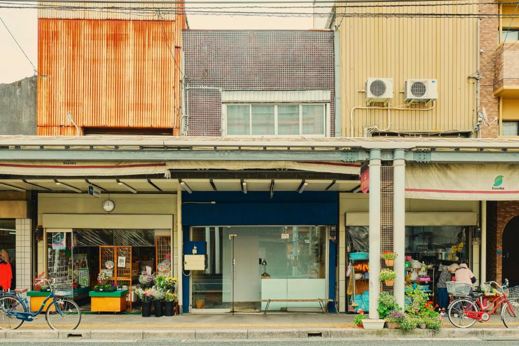 a group of buildings on a city street at まちの別邸 緝 shu in Kochi