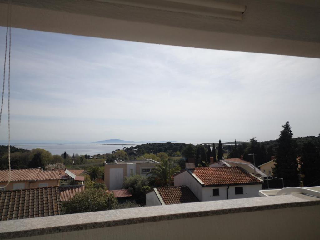 a view from the balcony of a house at Green Sea View Apartment in Premantura