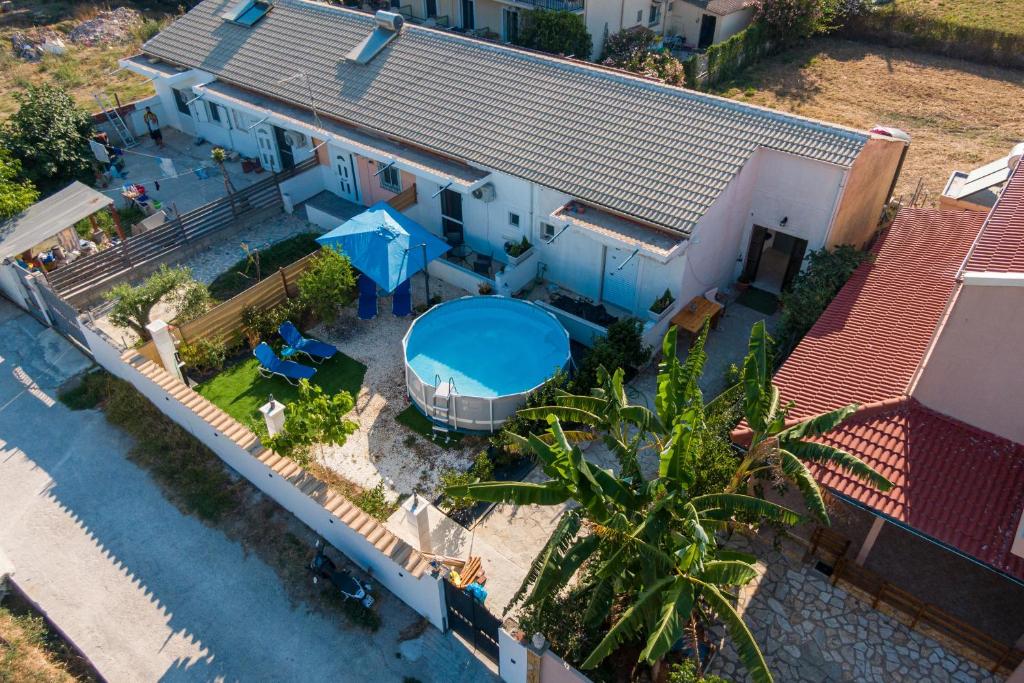 an aerial view of a house with a swimming pool at Relaxrooms in Lefkímmi