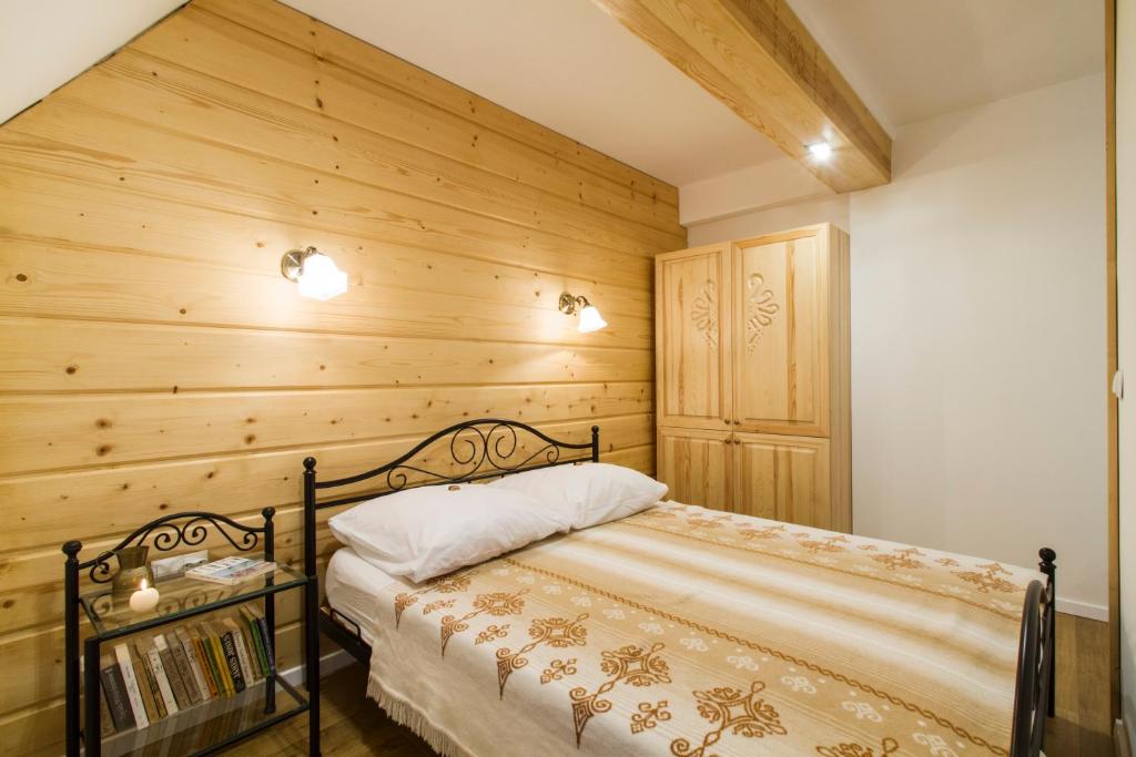 Posteľ alebo postele v izbe v ubytovaní Zakopane Apartamenty Skibówki