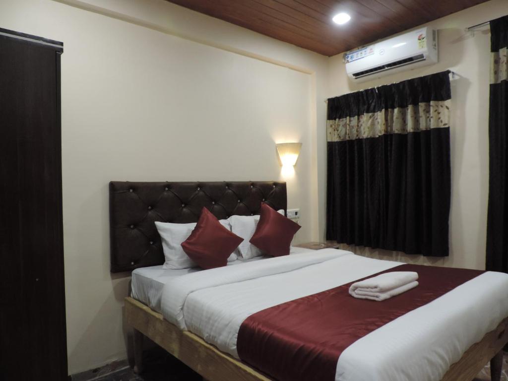 Ένα ή περισσότερα κρεβάτια σε δωμάτιο στο Punest Hospitality