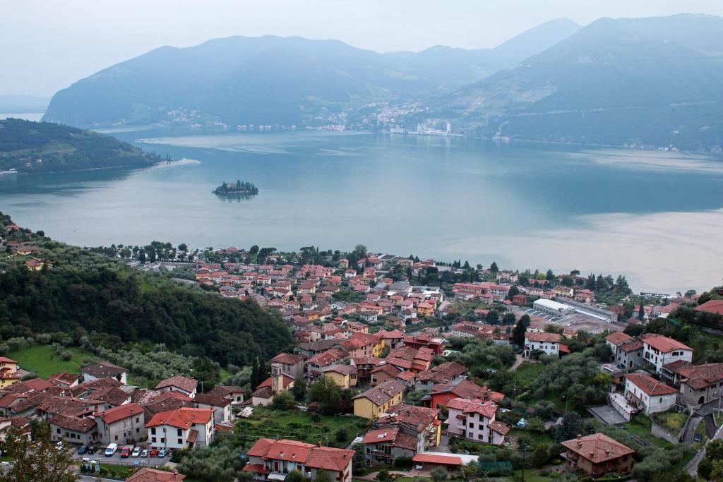 a view of a town and a large body of water at Agriturismo Cascina Lert in Marone