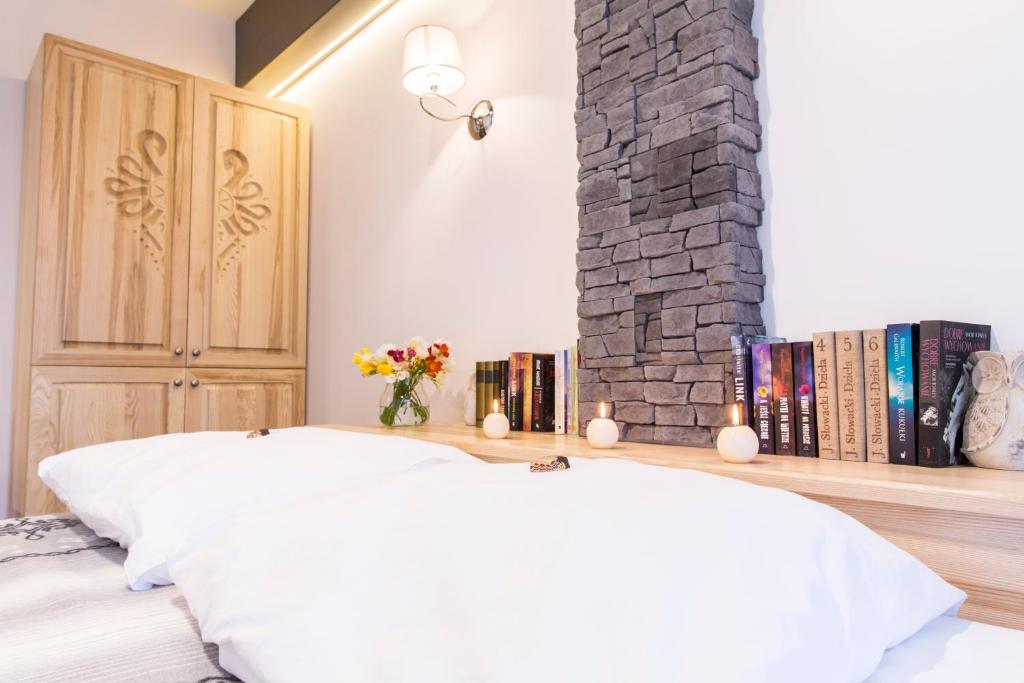 Posteľ alebo postele v izbe v ubytovaní Zakopane Apartamenty Skibówki