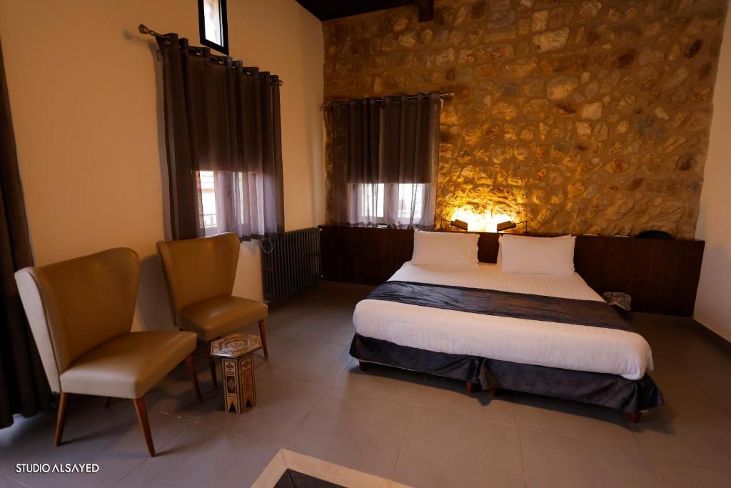 Postel nebo postele na pokoji v ubytování Domaine de Chouchene