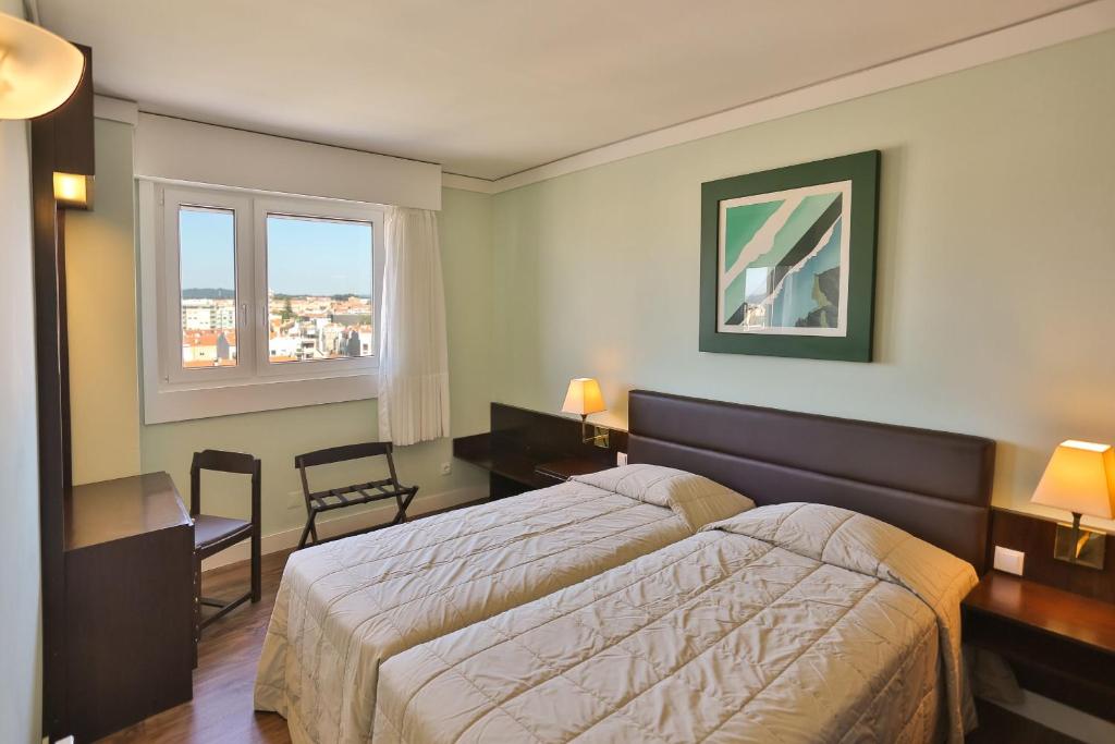 Postel nebo postele na pokoji v ubytování Hotel Apartamento Solverde