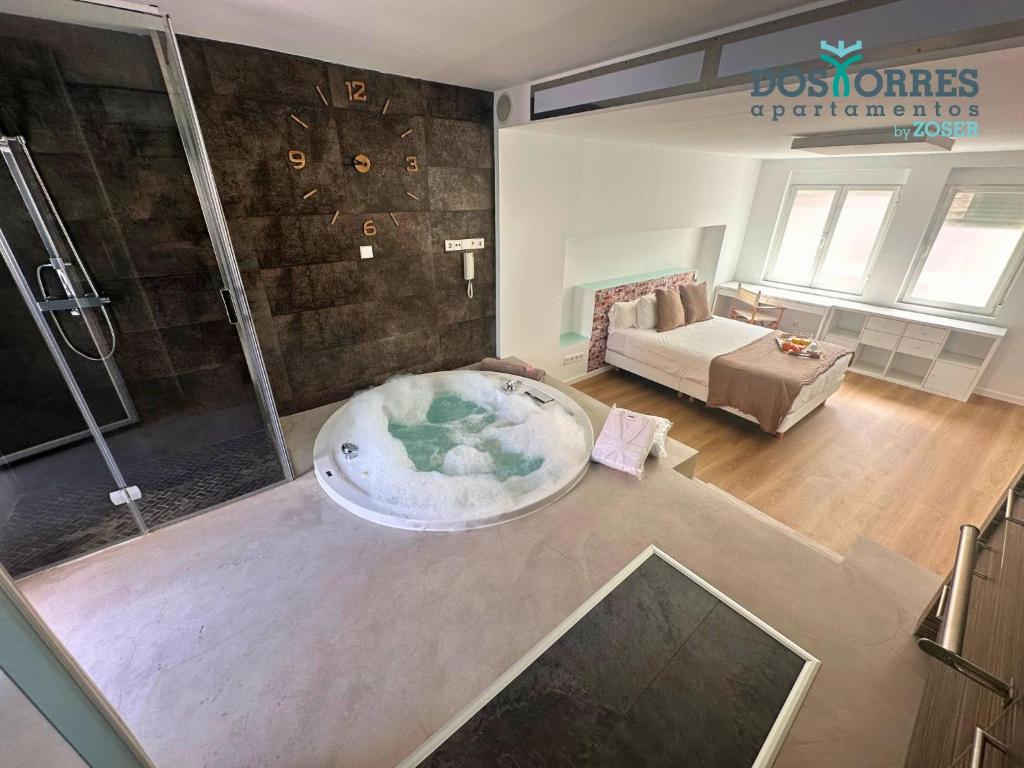 Postel nebo postele na pokoji v ubytování Suite Dos Torres Édoras con jacuzzi privado y parking gratuito en el centro