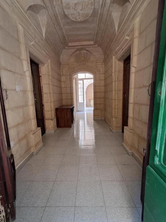 an empty hallway in a building with a ceiling at 63, Casa Falzon in Rabat