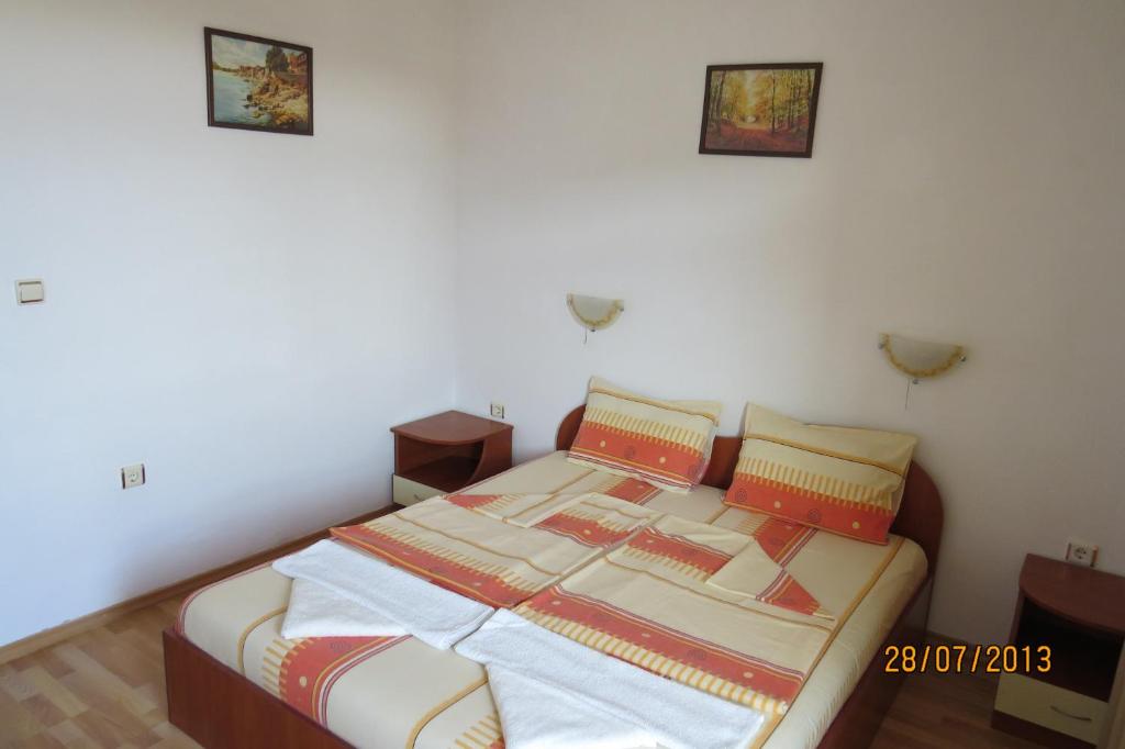 A bed or beds in a room at Hotel Strinava