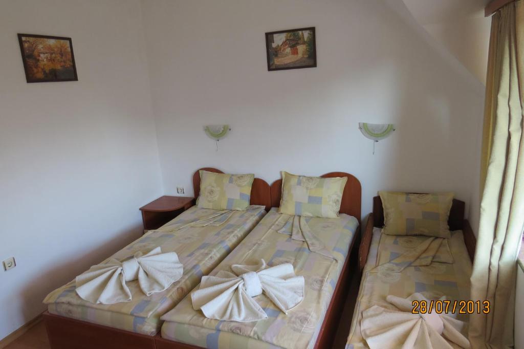 A bed or beds in a room at Hotel Strinava