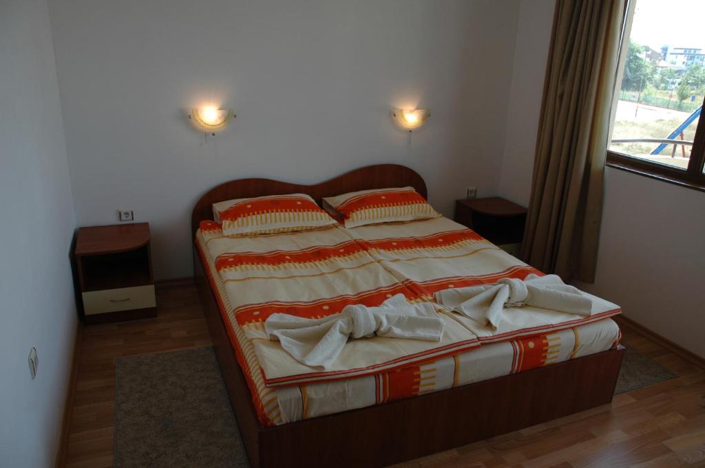 A bed or beds in a room at Hotel Strinava
