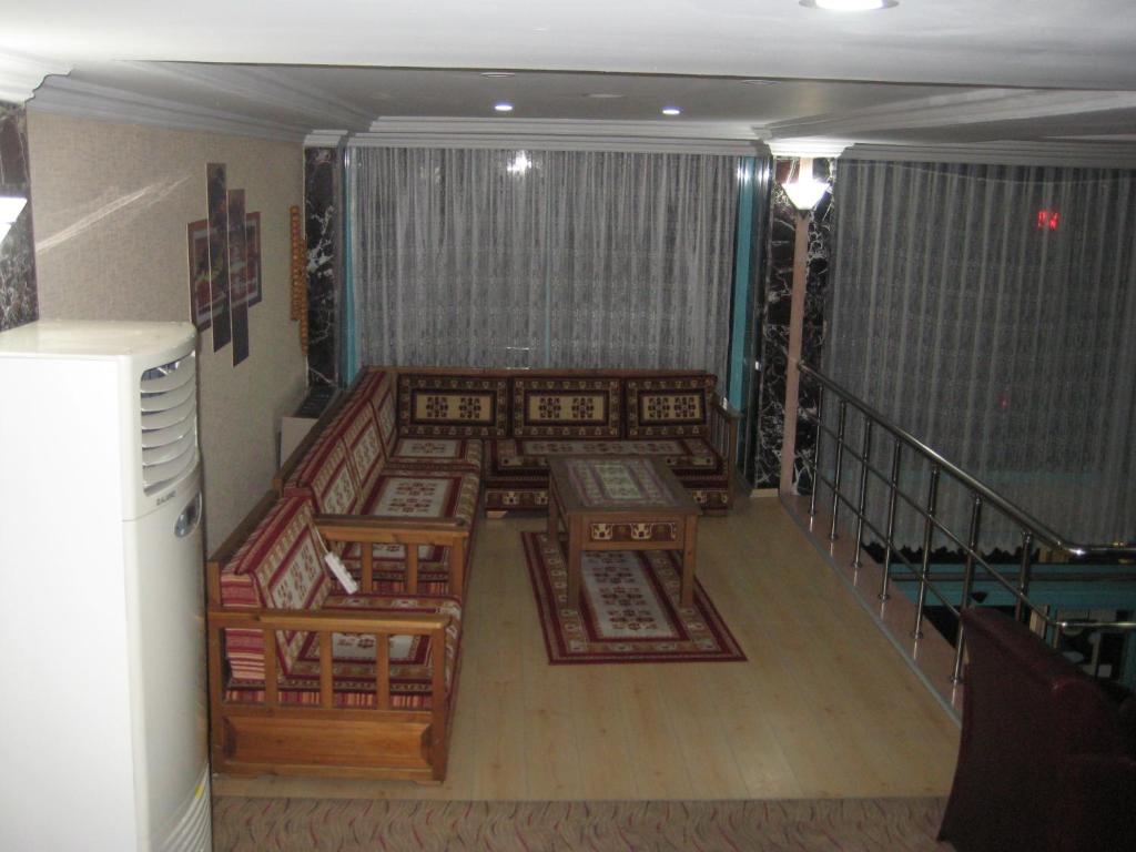 Postel nebo postele na pokoji v ubytování Miroglu Hotel
