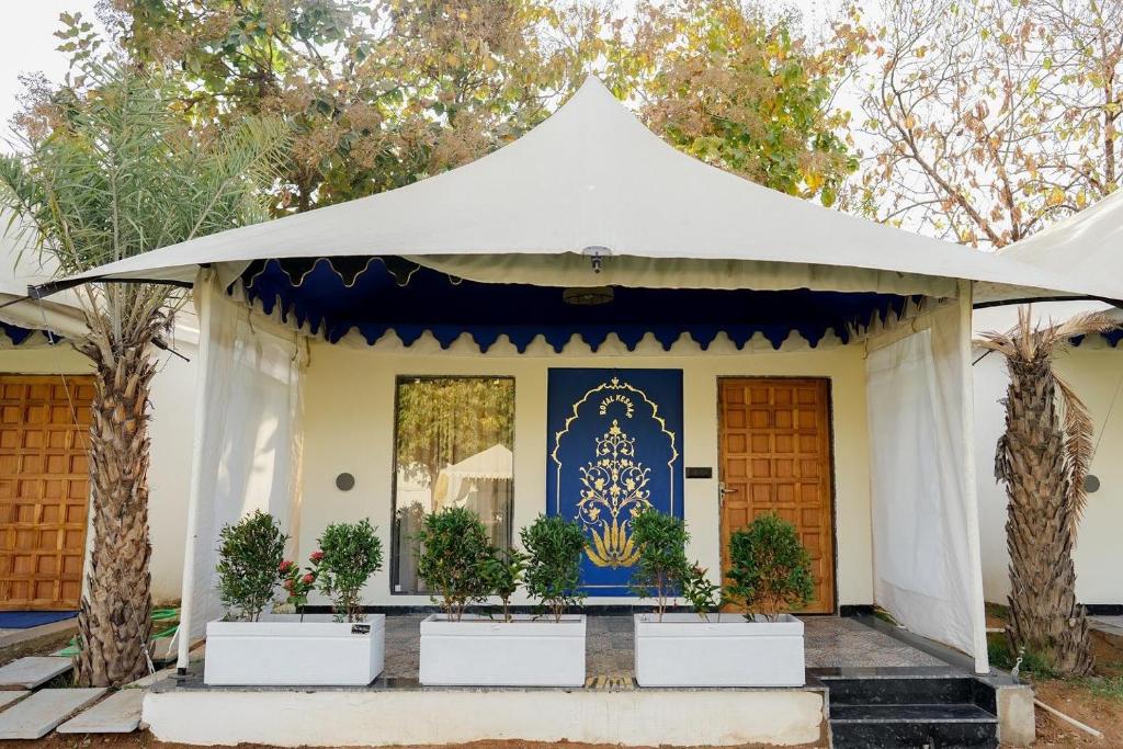 a white tent in front of a house at Gulbag Heritage in Jaipur