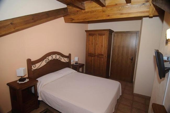 Postel nebo postele na pokoji v ubytování L'Era de Cal Bastida