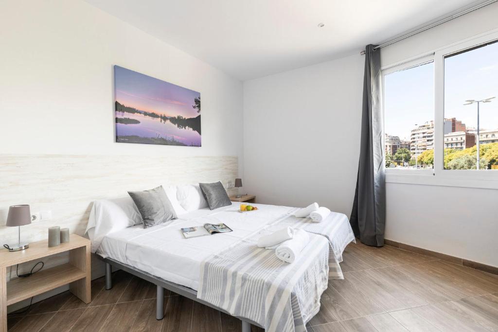 Postel nebo postele na pokoji v ubytování AB Sagrada Familia Views