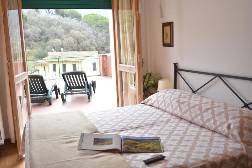 Postel nebo postele na pokoji v ubytování Hotel La Feluca