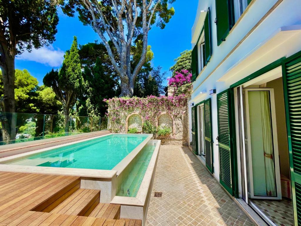 a swimming pool in the backyard of a house at Villa dei Galli - via Tragara in Capri