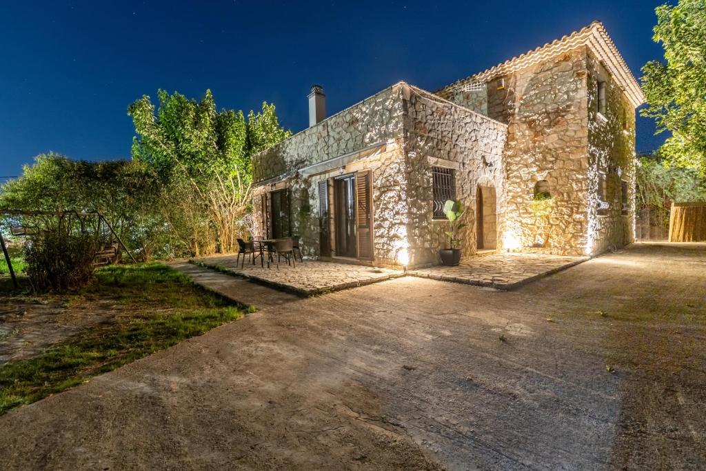 an external view of a stone house at Platanus Inn Villa by "elite" in Vanáton