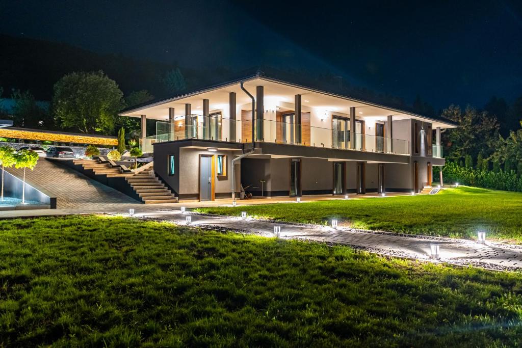 a house at night with a lawn in front at Hillmax Residence in Sarajevo