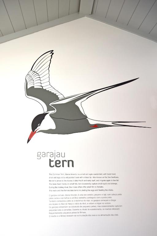 a page of a book with a drawing of a bird at Casa da Baía - Guest House in Horta