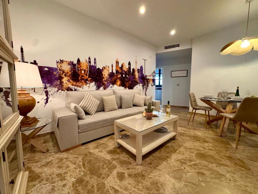 a living room with a couch and a table at inncadiz El Refugio de Gadir in Cádiz