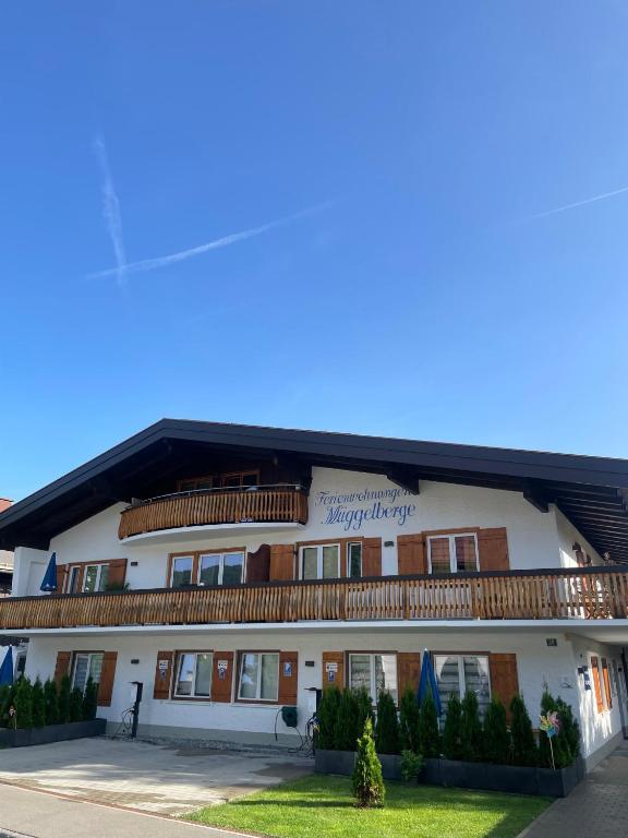 a large white building with a lot of windows at Ferienwohnungen Müggelberge in Oberstdorf