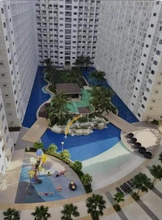a model of a water park in a city with tall buildings at AA's Property in Sampong