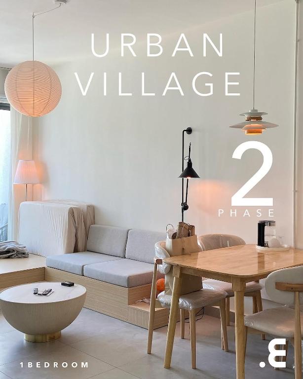 a living room with a couch and a table at Minimalist Living , One bedroom in Phnom Penh