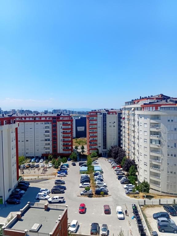 an aerial view of a parking lot in a city at Comfort hillside in Pristina