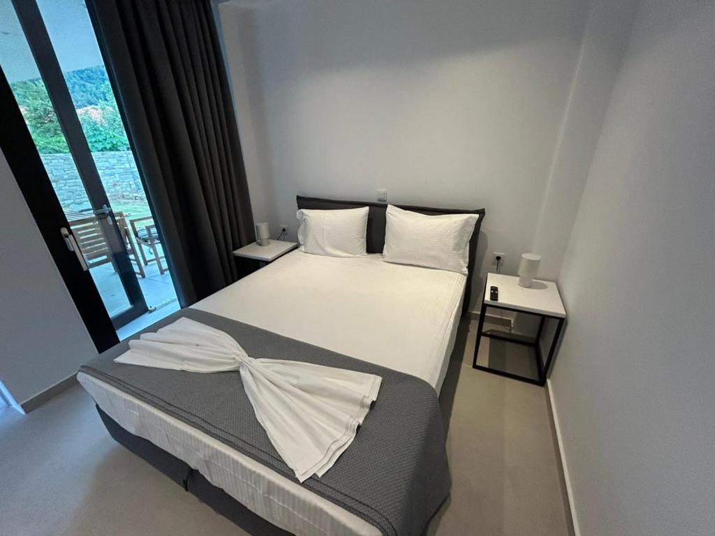 Ένα ή περισσότερα κρεβάτια σε δωμάτιο στο House Thomi