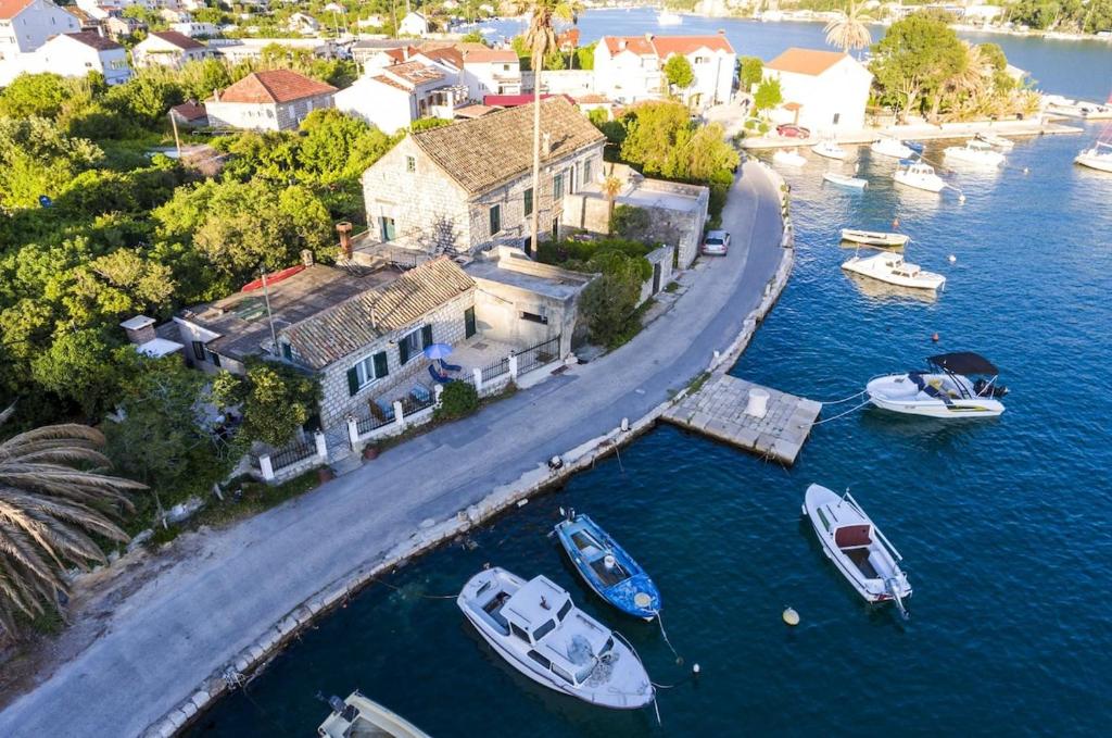 an aerial view of a house and boats in the water at KiM in Mokošica