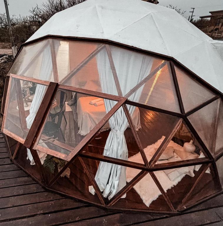 a dome tent on top of a wooden table at Glamping il Tramonto in Villa Amancay