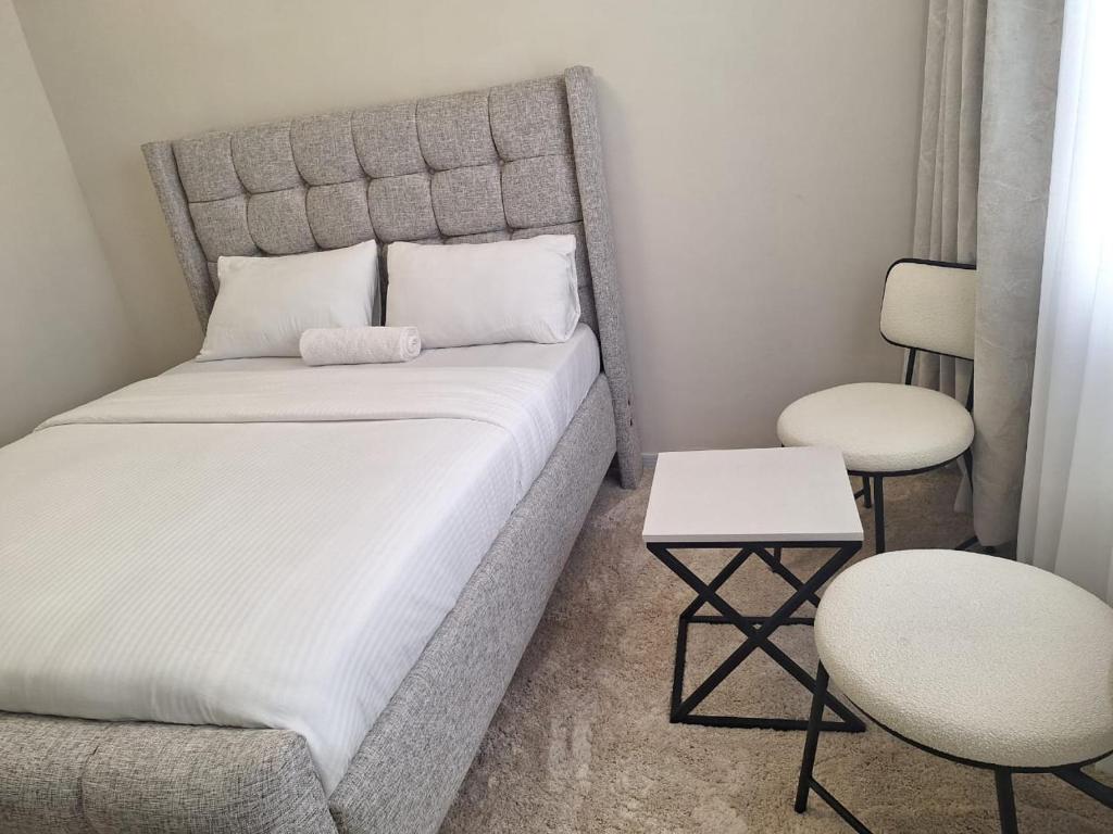 Matarimo Homes Apartmentにあるベッド