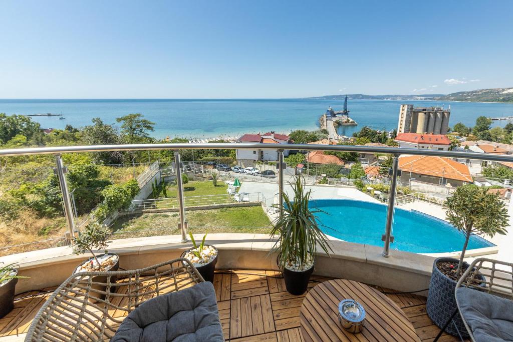 a balcony with a view of a swimming pool at Luxury Apartments Calithea-Balchik, Free Parking in Balchik