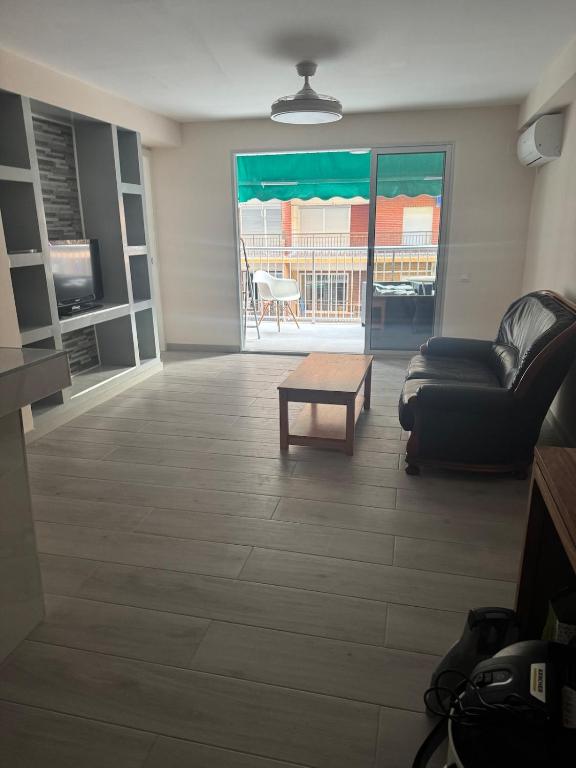 a living room with a couch and a coffee table at 2 bedroom apartment for rent in Cullera