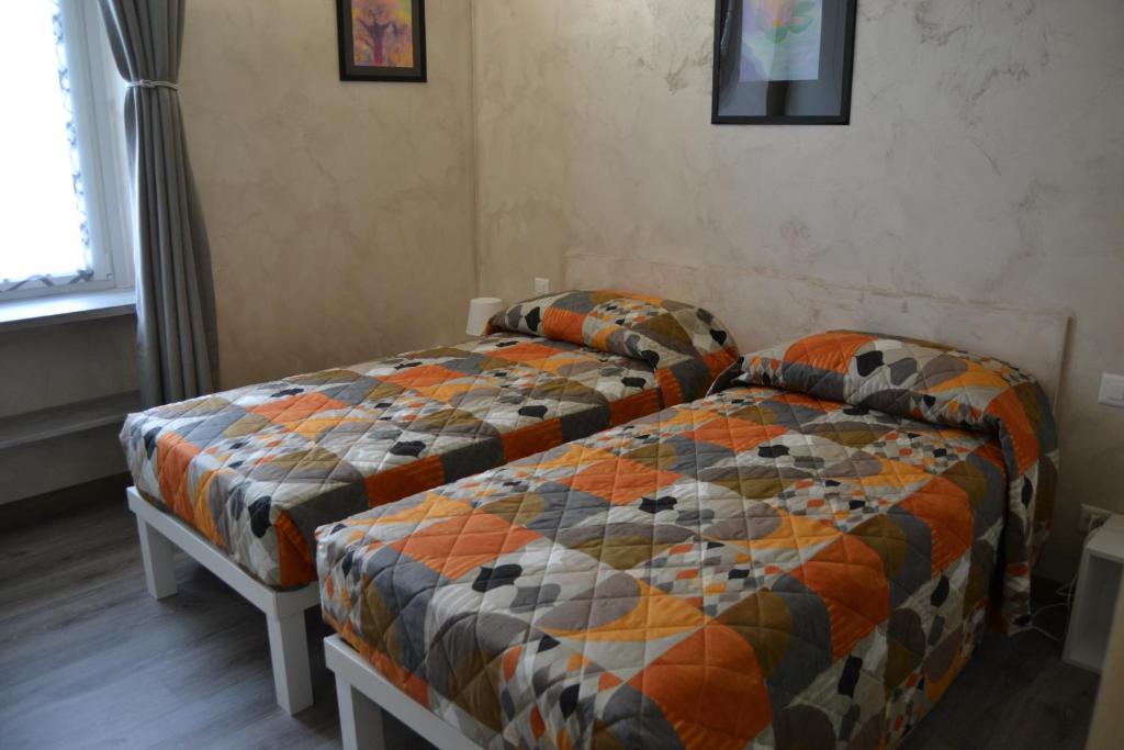 Postel nebo postele na pokoji v ubytování Osteria Centrale
