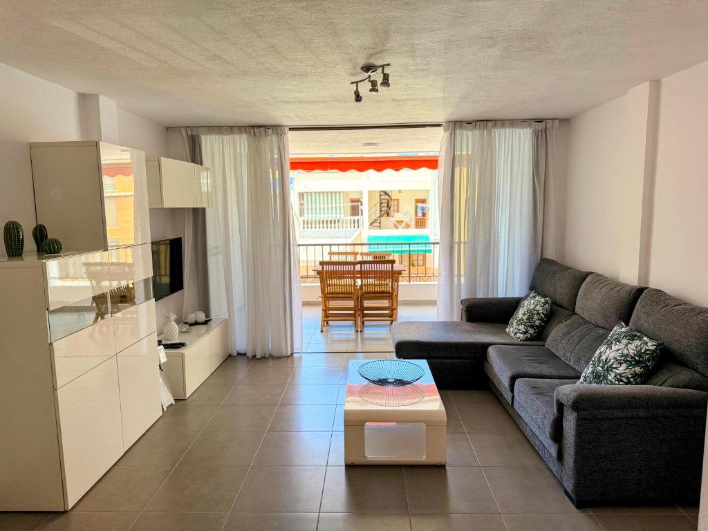 a living room with a couch and a table at Los Molinos in Puerto Naos