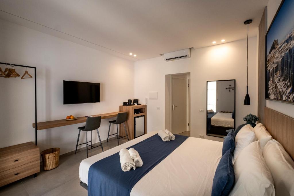 Ένα ή περισσότερα κρεβάτια σε δωμάτιο στο Al Capo Suite Home