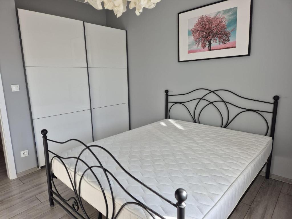 Postel nebo postele na pokoji v ubytování Milanos apartament
