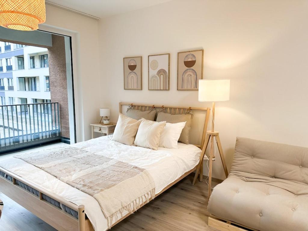 Postel nebo postele na pokoji v ubytování Jack apartman , 02 Arena ,PVA Expo, Free parking
