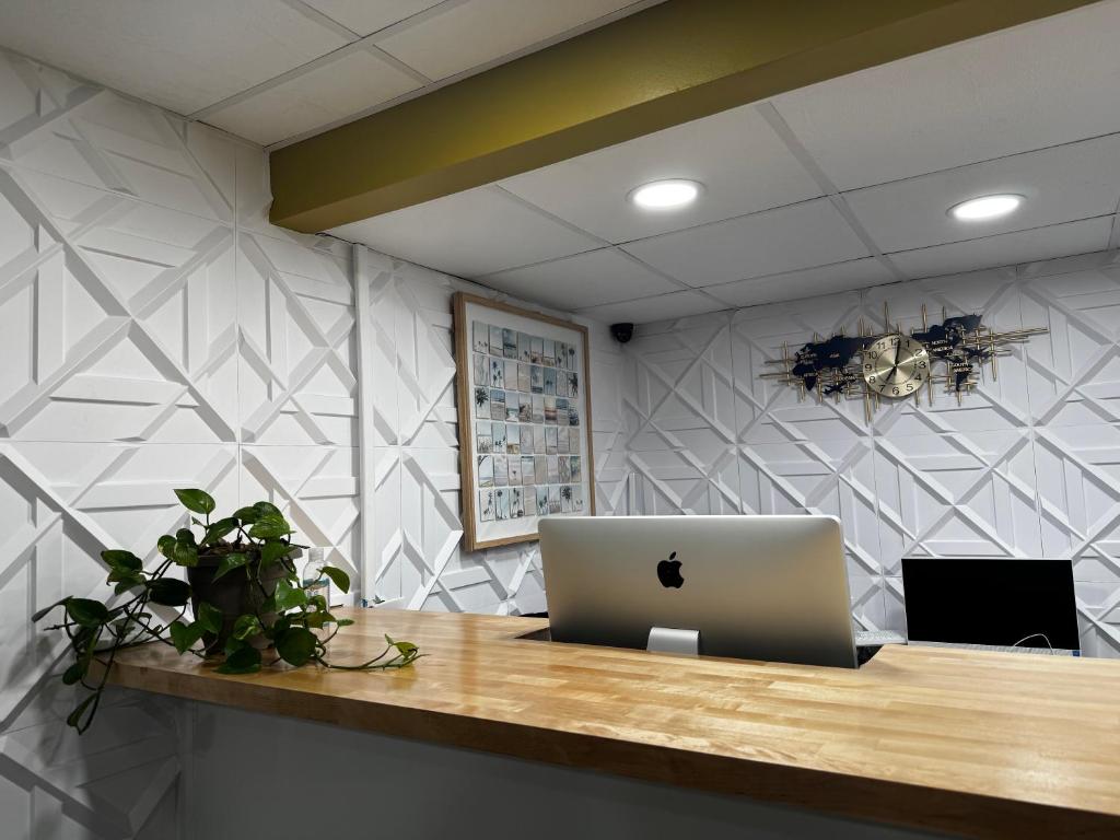 an office with a desk with a laptop on it at AIRE Hotel North Beach Jersey Shore in Seaside Heights
