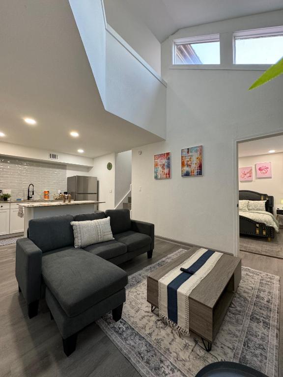 a living room with a couch and a table at 2BD STATE FAIR l DT Dallas l FIFA READY l 5 Min from Love Field in Dallas