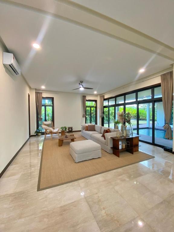 a large living room with a couch and a table at Fajar Loft in Putrajaya