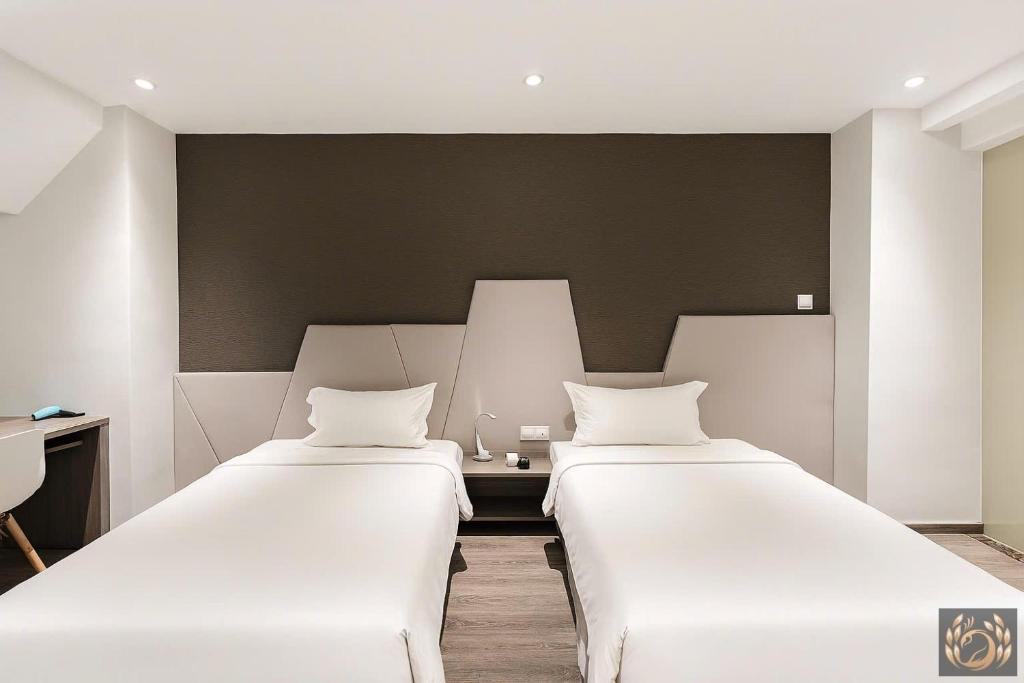 Giường trong phòng chung tại Kim Thanh Boutique Hotel Nha Trang