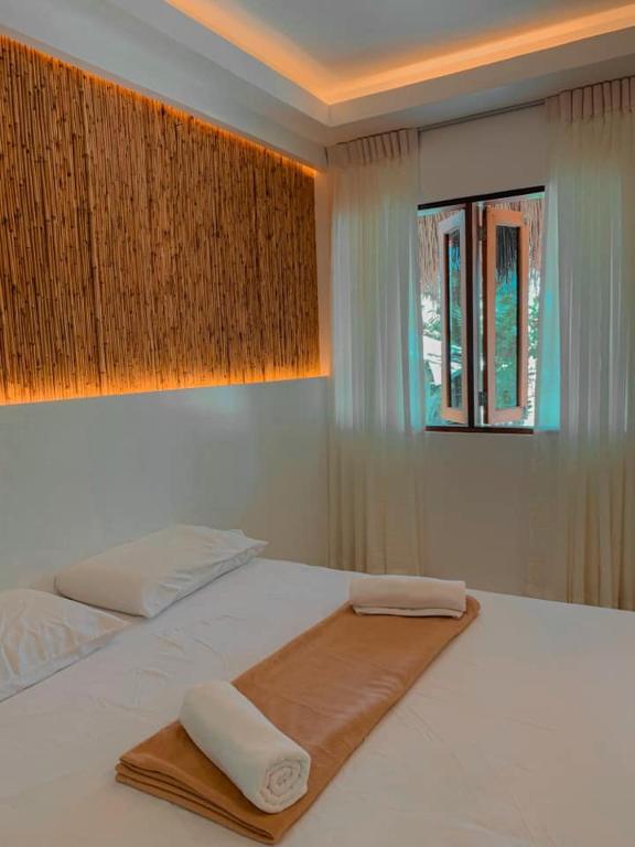 Postel nebo postele na pokoji v ubytování OCEAN 9 siargao