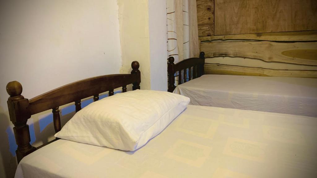 Ένα ή περισσότερα κρεβάτια σε δωμάτιο στο Nalinda's Homestay